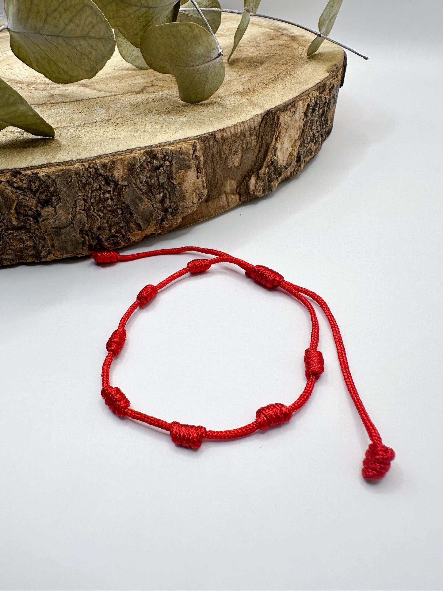 Pulsera roja de los 7 nudos